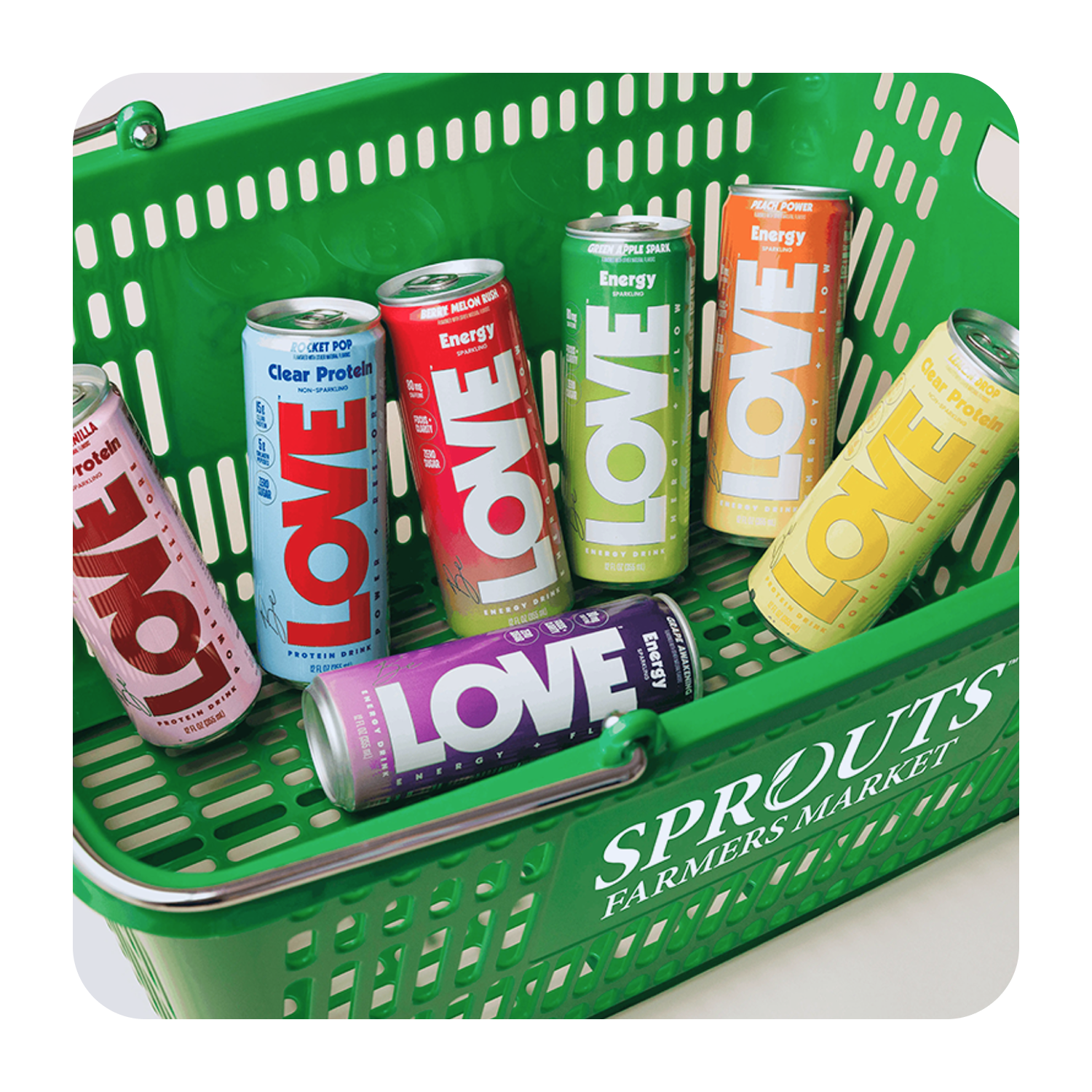 be love energy and clear protein drinks in a sprouts farmers market shopping basket